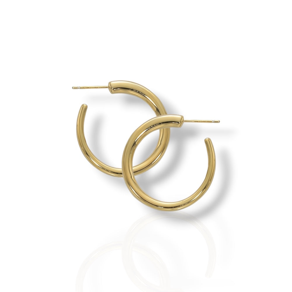 Gold hoop earrings on a white background