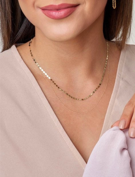woman is wearing a Gold Twinkle Mirror Link Necklace