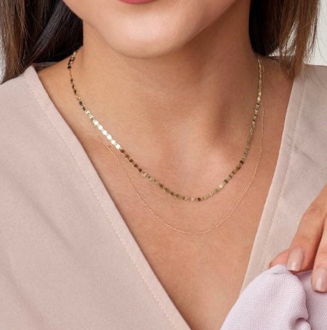 woman is wearing a Gold Twinkle Mirror Link Necklace