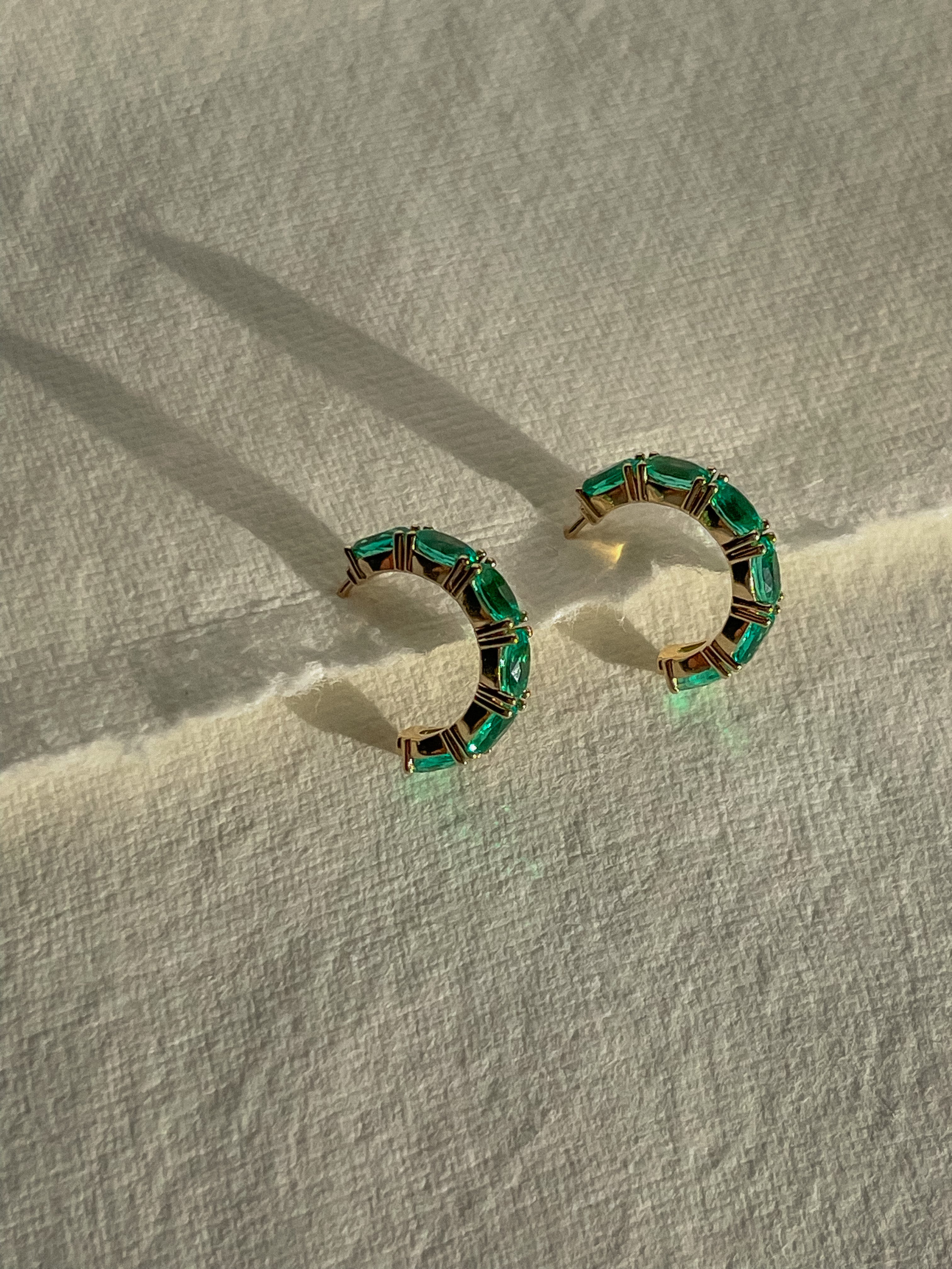 Emerald Orbit Hoops on a white paper background