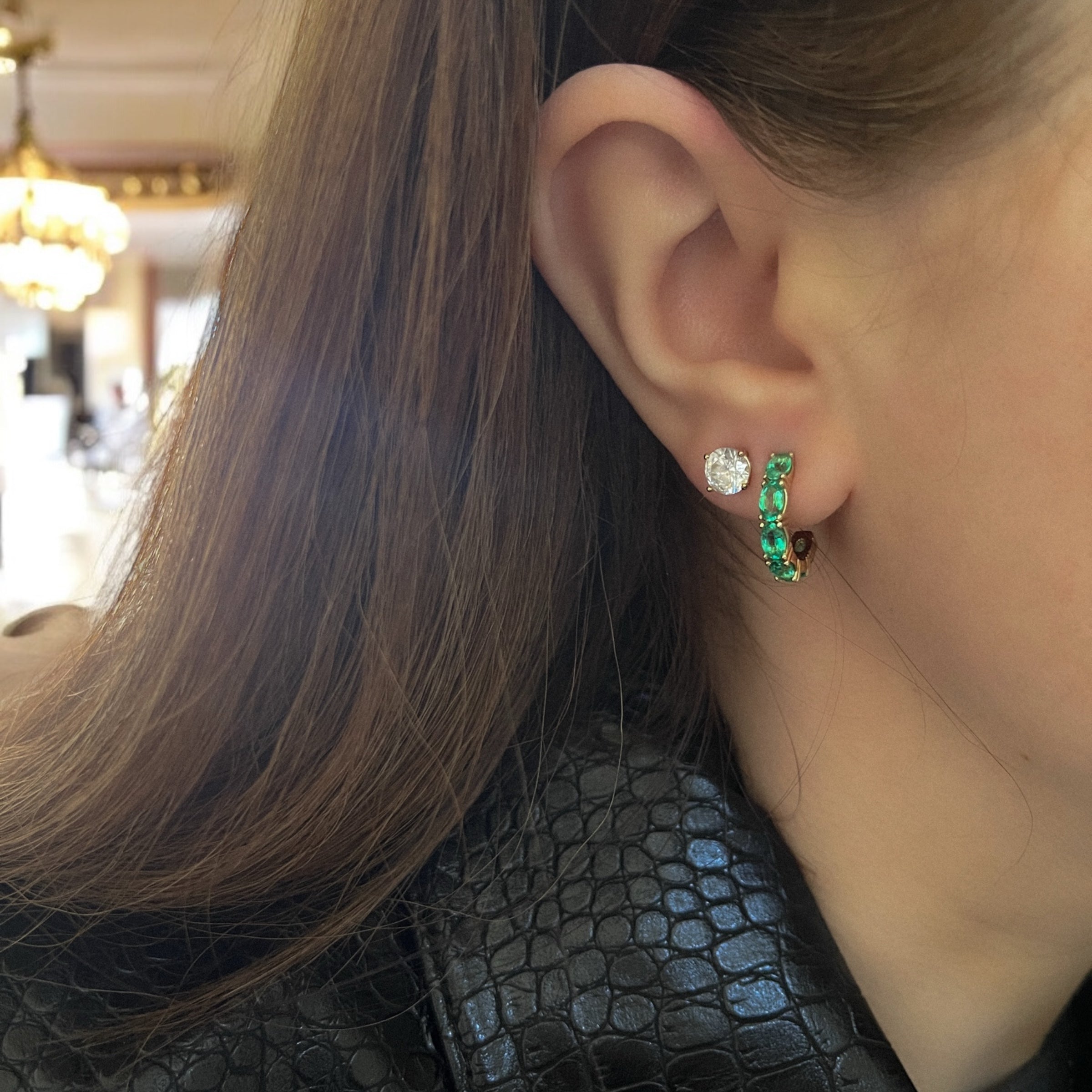 Woman wearing Emerald Orbit Hoops