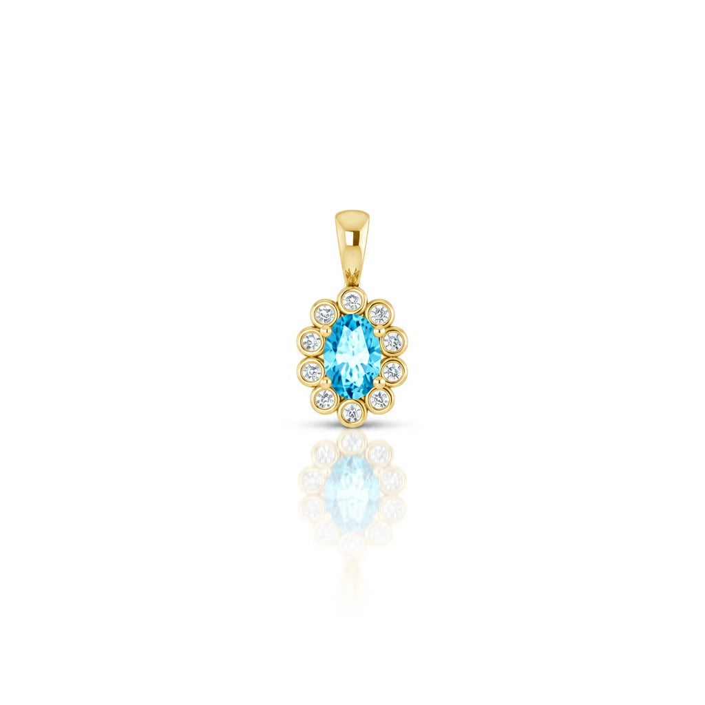 A yellow gold pendant featuring a central oval light blue aquamarine gemstone surrounded by a halo of small diamonds, shown on a white background with a soft reflection below.